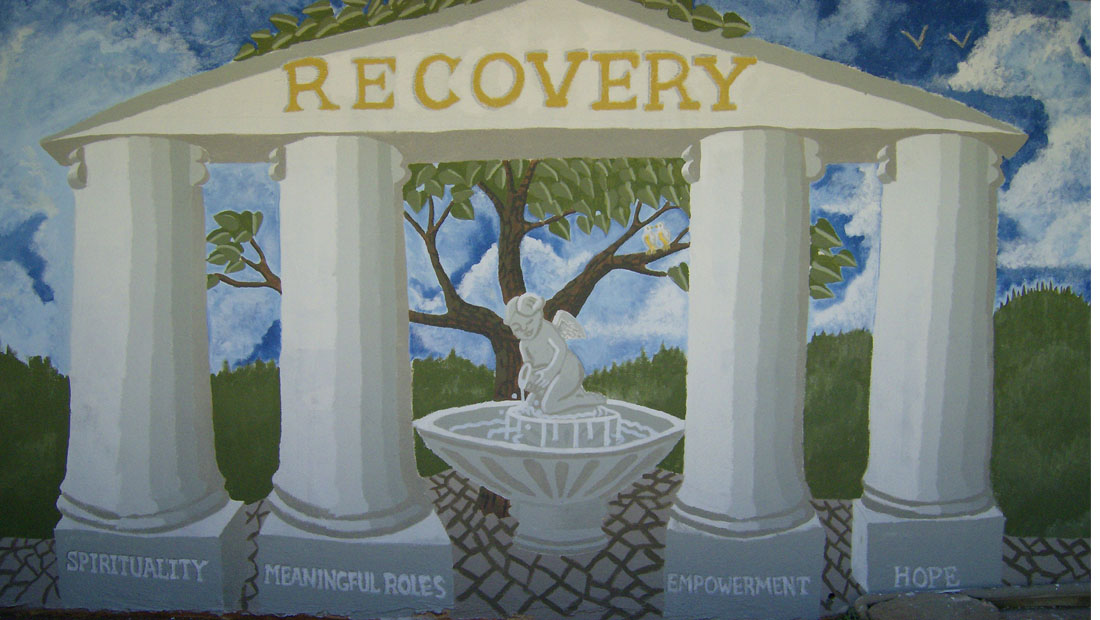 four pillars of recovery with fountain in middle