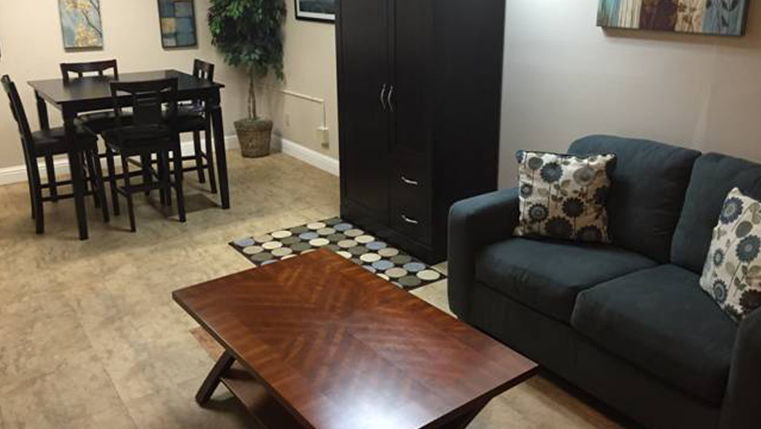 Dining table with coffee table, couch and armoire